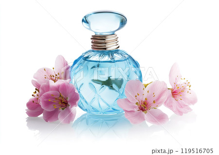Beautiful blue glass perfume bottle surrounded by delicate pink cherry blossoms on a white 119516705