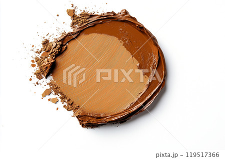 Rich brown cream displayed on a white surface reflects artistic makeup application techniques for 119517366
