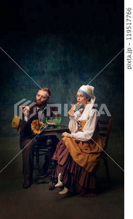 Cinematic portrait of man and woman sitting, drinking and eating pizza. Van Gogh and girl with white pearl at modern dinner. 119517766
