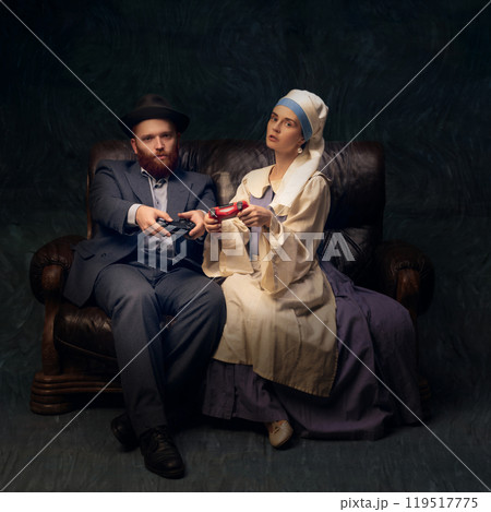Couple in vintage European clothing playing video games, blending old-world fashion with modern entertainment in playful scene. 119517775