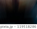 A blurred view of a door with warm tones during evening hours, creating a mysterious ambiance in a dimly lit space 119518286
