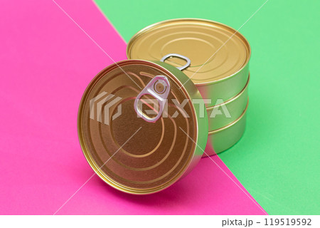 A Group of Stacked Tin Cans on Split Green and Cyan Background A Group of Stacked Tin Cans on Split Green and Cyan Background 119519592