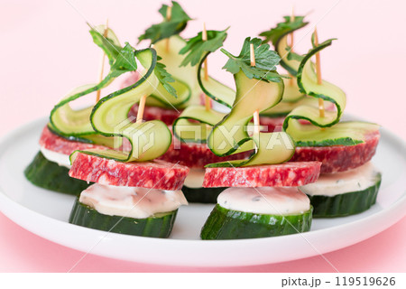 Canapes without Bread with Salami, Cucumber, Greens and Cream Cheese on White Plate Canapes without Bread with Salami, Cucumber, Greens and Cream Cheese on White Plate 119519626