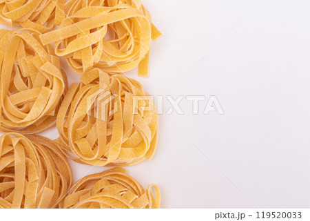 Classic Italian Raw Egg Fettuccine on White Background 119520033