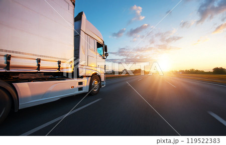 European truck driving on the asphalt road in rural landscape at sunset 119522383
