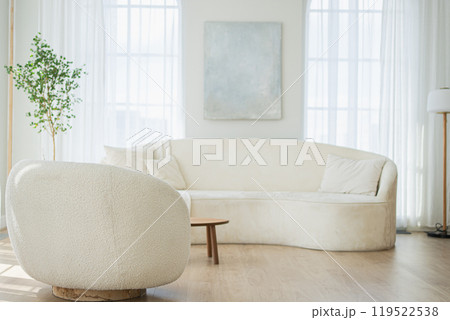 Stylish loft bedroom interior. Spacious design apartment with light walls large windows white couch sofa and armchair. Clean modern decoration with elegant furniture in minimalist Scandinavian style Stylish loft bedroom interior. Spacious design apartment with light walls large windows white couch sofa and armchair. Clean modern decoration with elegant furniture in minimalist Scandinavian style 119522538