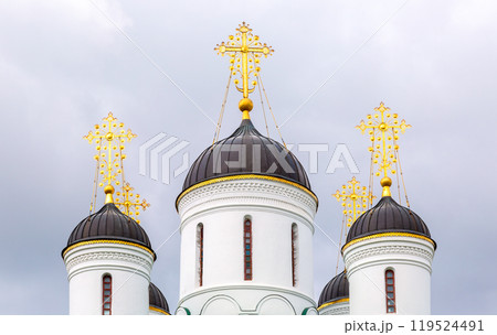 Domes of an Orthodox church with golden crosses 119524491