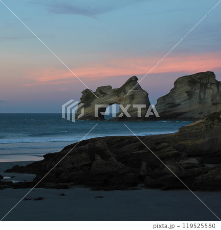 Rock formation at sunset, Wharariki Beach, New Zealand. Rock formation at sunset, Wharariki Beach, New Zealand. 119525580