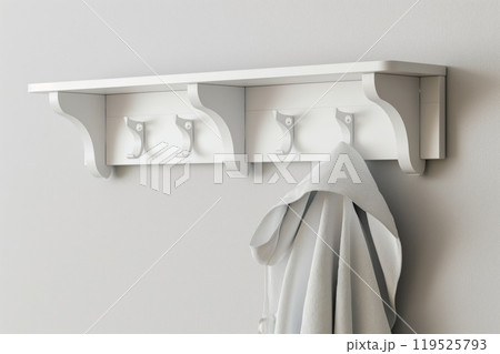 Sleek white coat rack with minimalist design hanging on a clean wall, featuring one coat 119525793