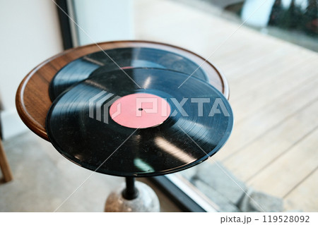 Vinyl record on wooden table. Vintage music nostalgia 119528092