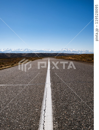 Long straight road through desert landscape. Journey into the horizon Long straight road through desert landscape. Journey into the horizon 119528095