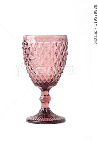 Red textured vintage crystal drinking glass isolated on white background. vintage glass 119529988