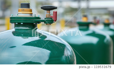 Industrial gas tanks safety valve in focus at factory site 119531679