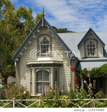 Small old timber cottage in Akaroa, New Zealand. 119534060