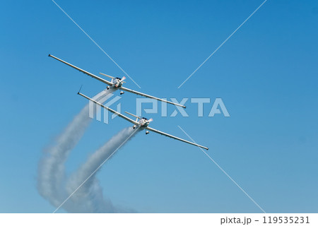 Stunt aerobatic plane performing stunts in air 119535231