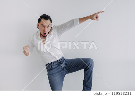 Winner face long hair man bun in white shirt and jean stand on white. 119538231