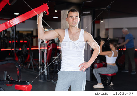 Young athletic man posing in gym Young athletic man posing in gym 119539477
