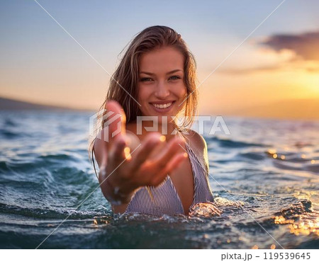 海の中でカメラに向かって手を差し伸ばす女性 119539645