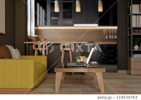 A laptop on a coffee table in a living room, featuring an open kitchen space in the background. A laptop on a coffee table in a living room, featuring an open kitchen space in the background. 119539763