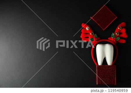 Teeth with Christmas accessories around, flat lay. 119540959