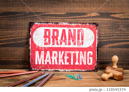 Brand Marketing Concept. Sign with text on a wooden texture office table 119545374