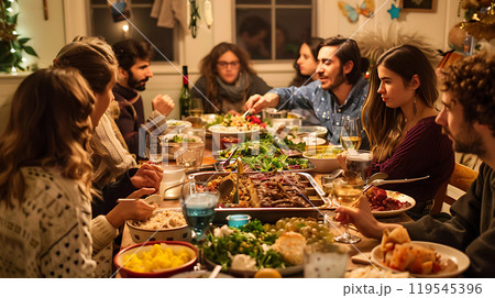 Group of friends having dinner together at home, celebrating Christmas or New Year 119545396