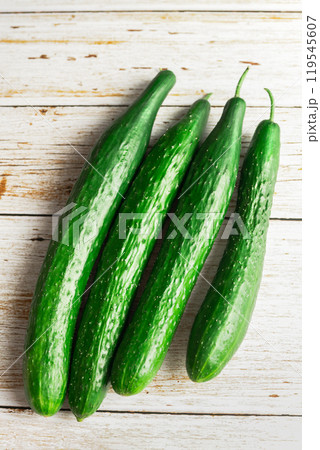 fresh cucumbers on white wooden table 119545607