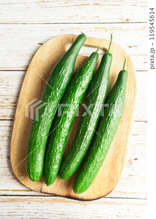 fresh cucumbers on a wooden board 119545614