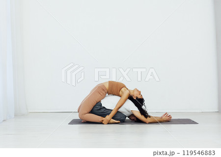 A man and a woman are engaged in steam yoga asana gymnastics fitness 119546883
