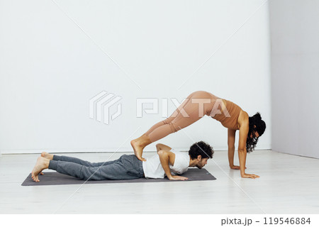 Man And Woman Doing Steam Yoga Asana Gymnastics 119546884