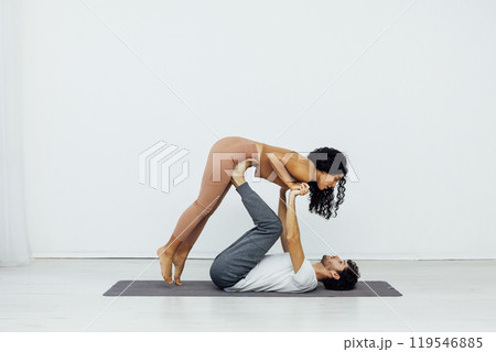 Man And Woman Doing Steam Yoga Asana Gymnastics 119546885