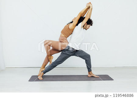 Man and woman doing yoga exercises meditation asana pose 119546886