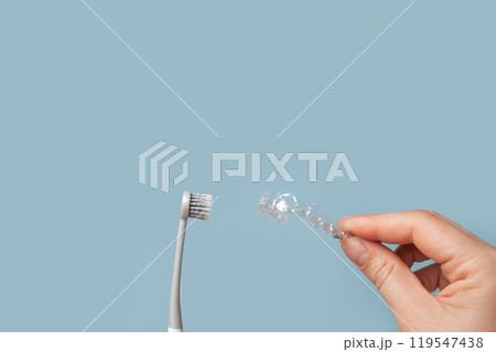 Transparent Dental Clear Aligners on Blue. Invisible Braces. Prevention Gums Treatment. Retainers for Dentistry Correction. Invisalign Orthodontics concept. Alignment of Teeth. Dentofacial Orthopedics 119547438