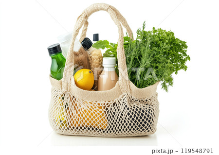 Reusable grocery bag filled with fresh vegetables, fruits, and healthy drinks in a bright, clean 119548791