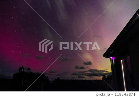 The Aurora Borealis, the northern lights, showing up above bungalow in County Donegal, Ireland The Aurora Borealis, the northern lights, showing up above bungalow in County Donegal, Ireland 119548871