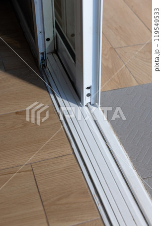 Dust on bottom sliding door sills and tracks,  these areas need cleaning. 119549533