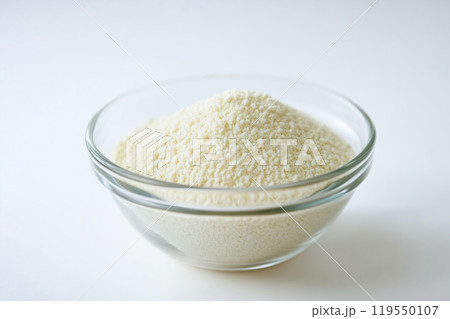 Fine flour piled in a glass bowl ready for baking, captured in a bright kitchen setting during Fine flour piled in a glass bowl ready for baking, captured in a bright kitchen setting during 119550107