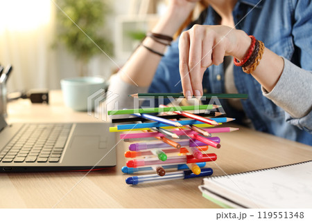 Bored lazy student girl wasting time at home 119551348