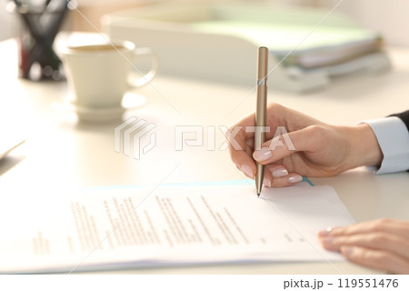 Business woman hand signing contract in the office Business woman hand signing contract in the office 119551476