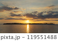 the sun is setting over a small island in the middle of the ocean 119551488