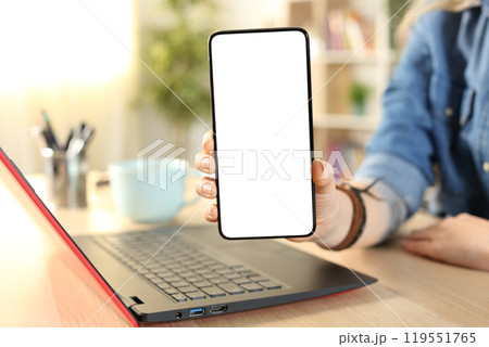 Student hands showing blank phone screen at home Student hands showing blank phone screen at home 119551765
