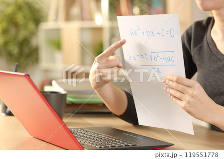 Teacher hands teaching online lesson on videocall at home Teacher hands teaching online lesson on videocall at home 119551778