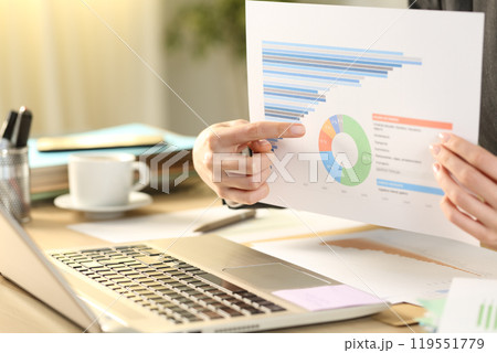 Teleworker showing chart on video call using laptop Teleworker showing chart on video call using laptop 119551779