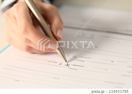Woman hand filling out form checking yes box Woman hand filling out form checking yes box 119551795