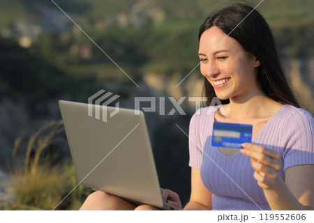 Asian woman buying online in the mountain 119552606