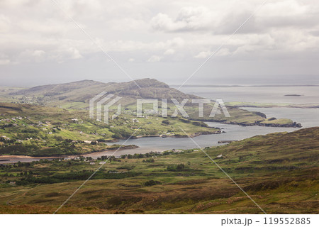Vintage style view of Donegal valley with green pastures villages and calm coastal waters Vintage style view of Donegal valley with green pastures villages and calm coastal waters 119552885