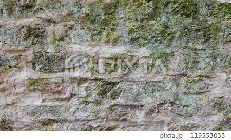 Textured Stone Wall With Moss and Lichen in Natural Setting During Daylight Textured Stone Wall With Moss and Lichen in Natural Setting During Daylight 119553033