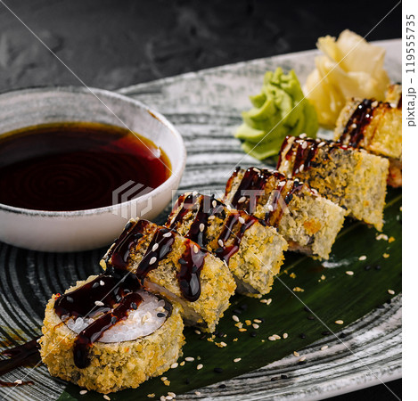 Delectable sushi roll platter with soy sauce Delectable sushi roll platter with soy sauce 119555735
