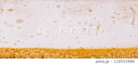 White cream filling on top of golden sponge cake texture background 119555996