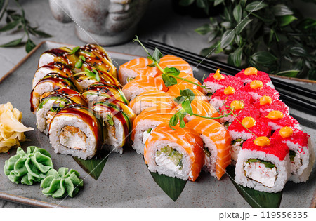 Variety of delicious sushi rolls being served on a plate 119556335